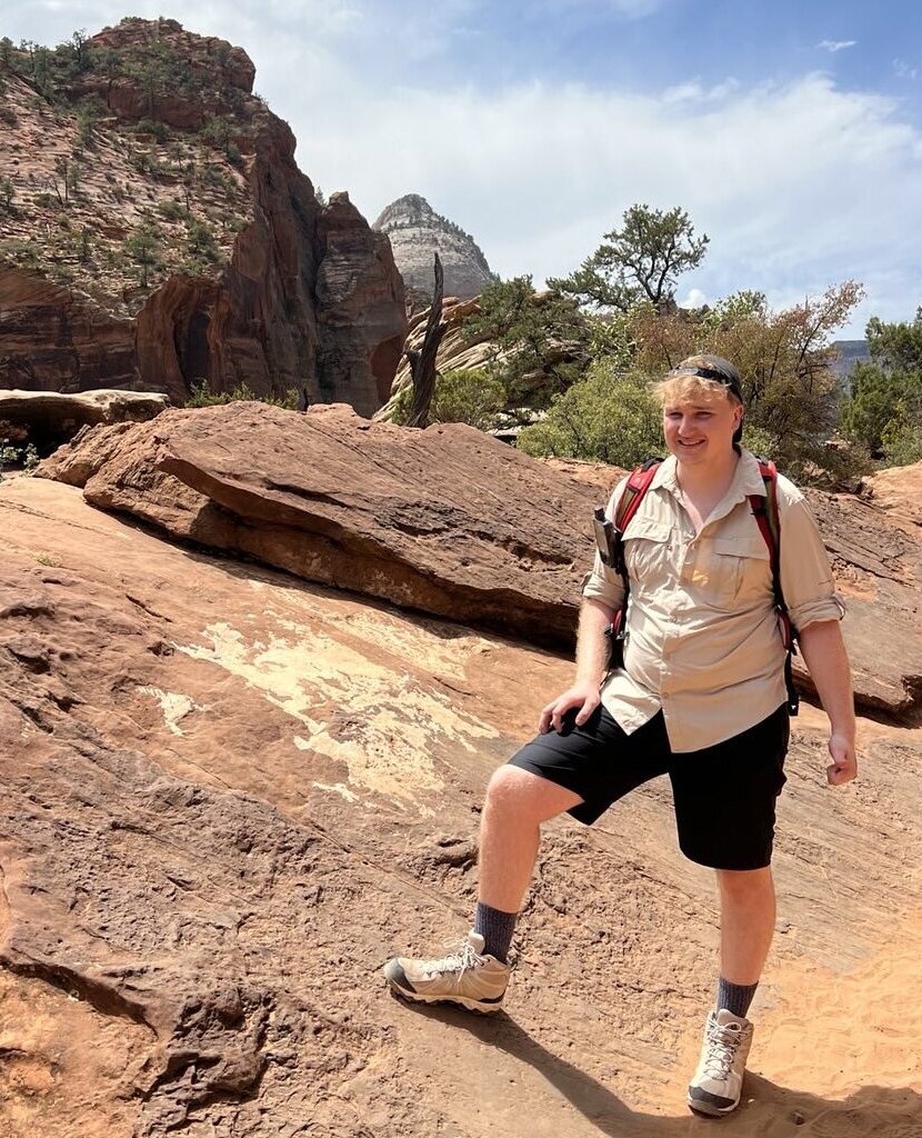 Profile Picture of Adrián Moreno (@zetxek), working side by side with a colleague: sitting on a desk, while looking at a screen